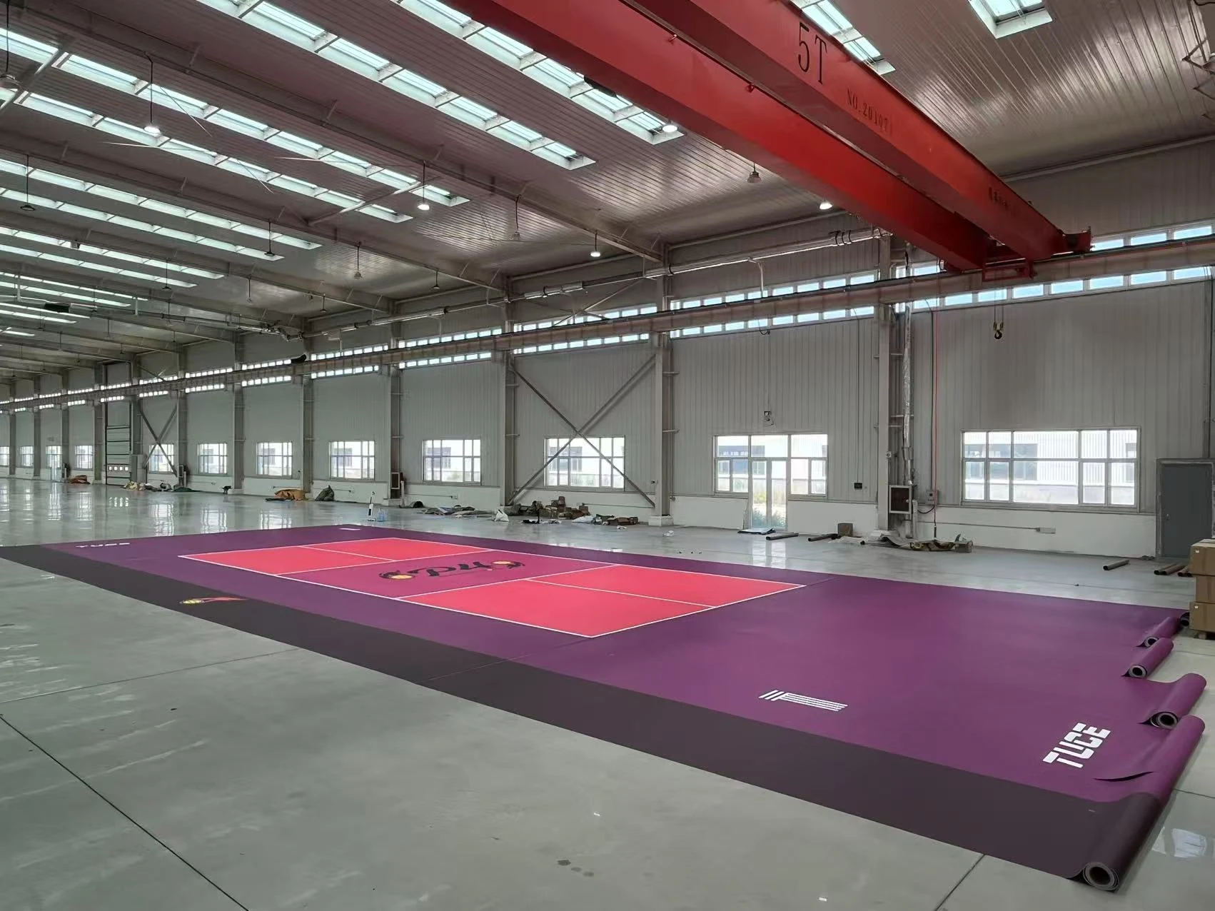 Custom 3 mm PVC pickleball flooring prepared for installation in a commercial venue